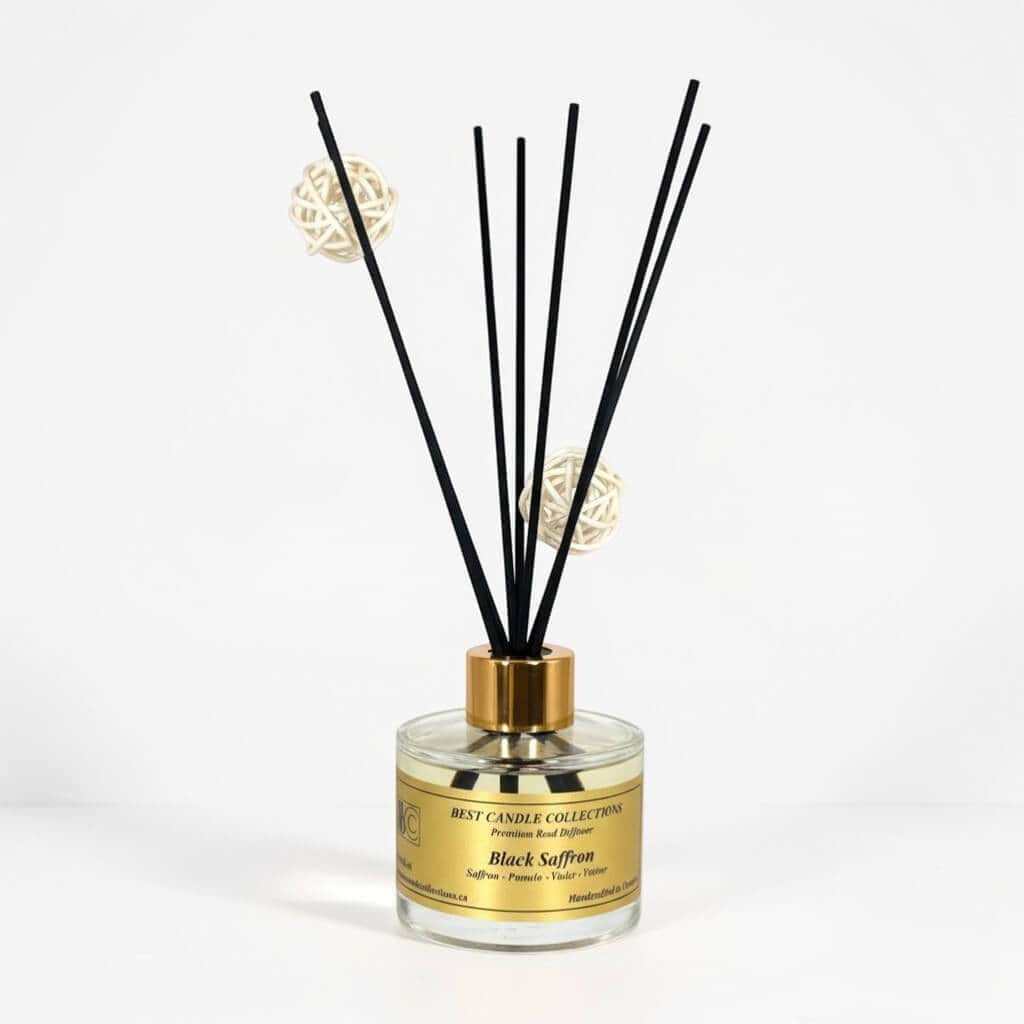 Reed diffuser with black sticks and decorative balls, ideal for elegant home fragrance.