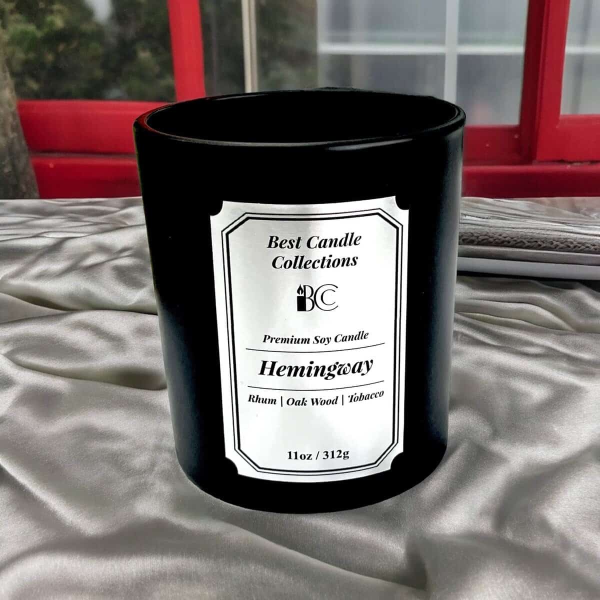 Black Hemingway soy candle with white label, premium quality, 11oz size.