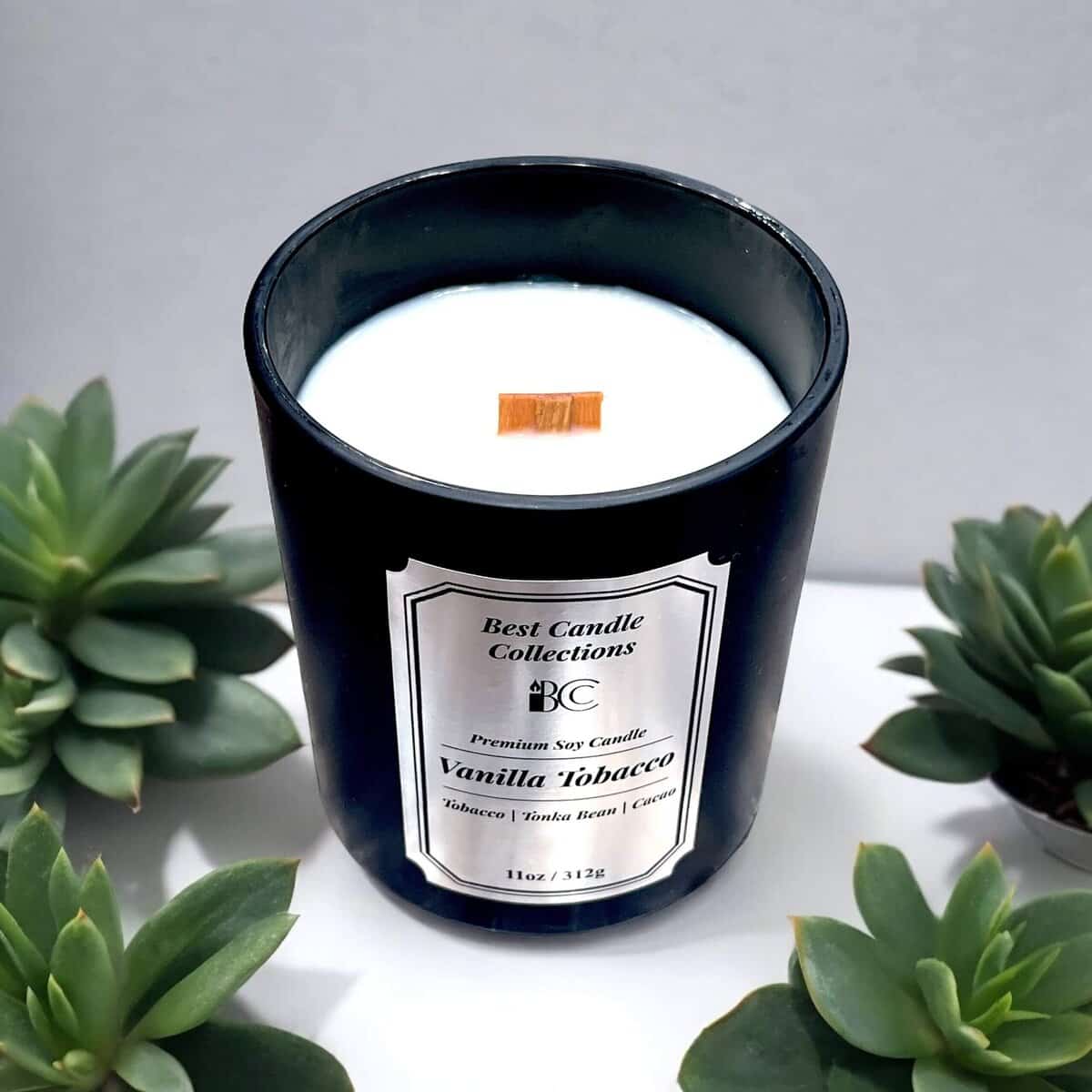 Vanilla Tobacco scented soy wax candle in a black jar, perfect for relaxing.