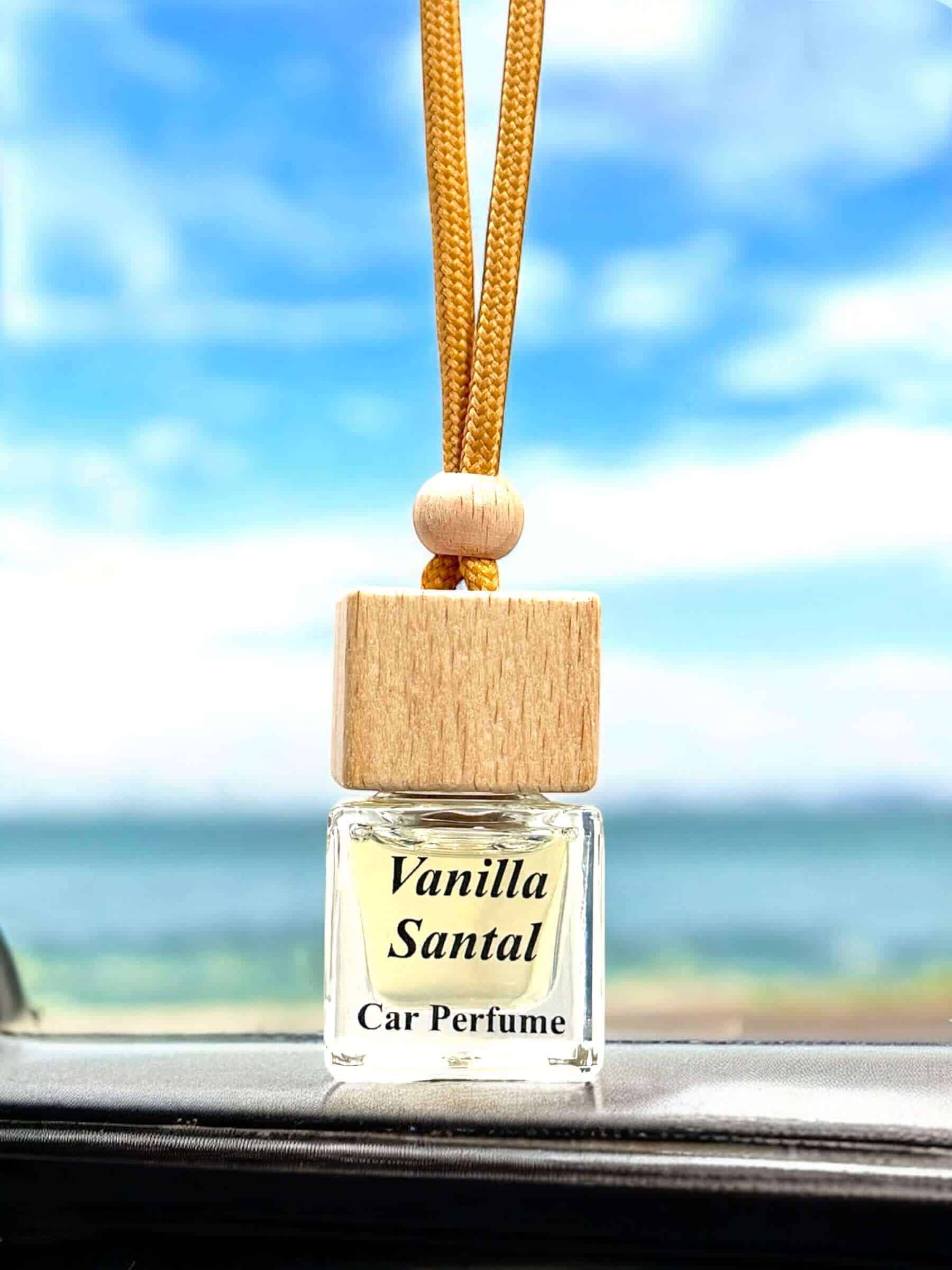 Vanilla Santal car diffuser with wooden cap and hanging cord.