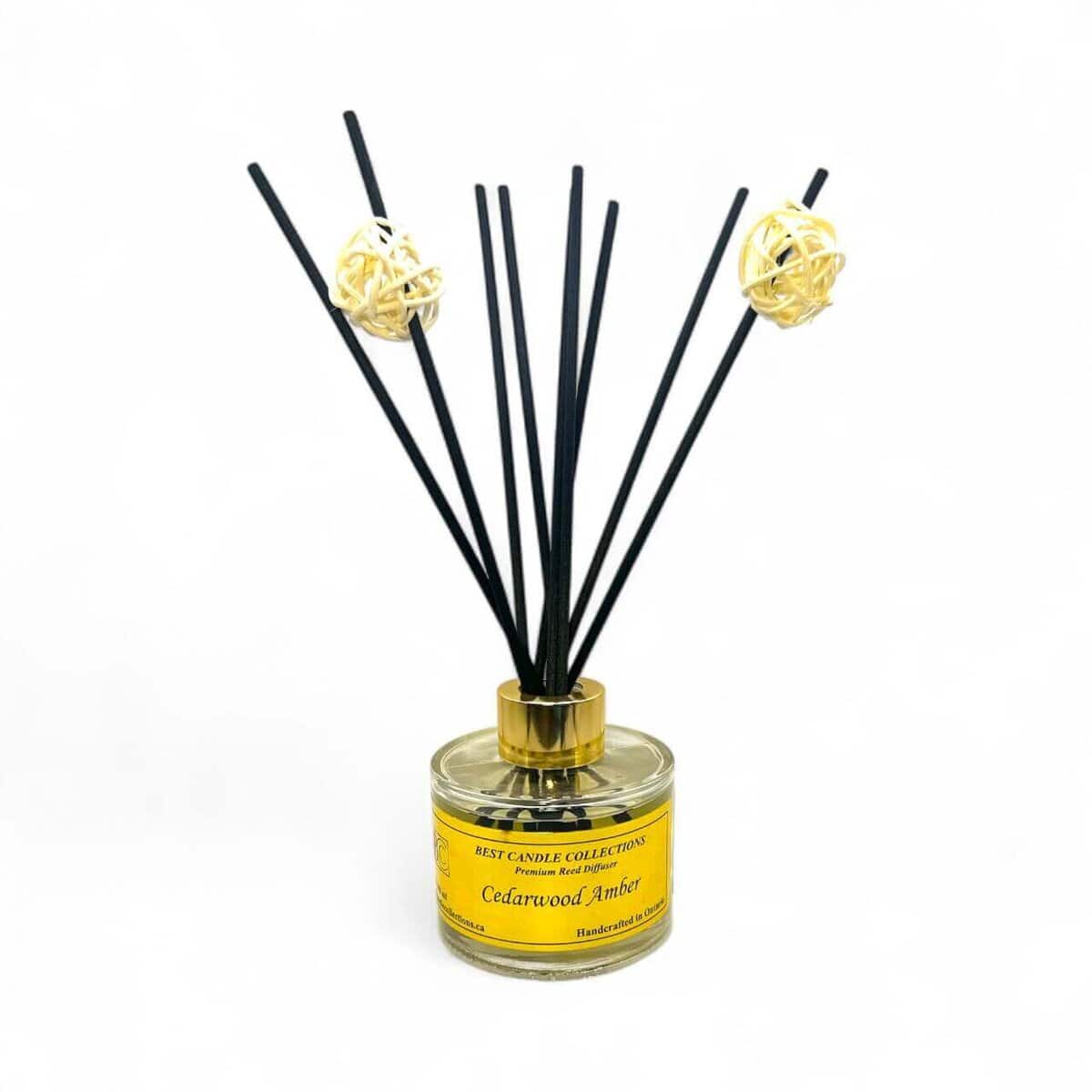 Reed diffuser with cedarwood and amber scents for home fragrance. Elegant design enhances any space.