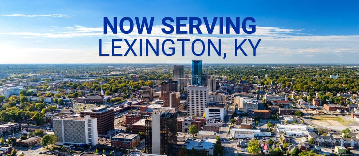 Skyline view of Lexington, Kentucky with the words 'NOW SERVING LEXINGTON, KY"
