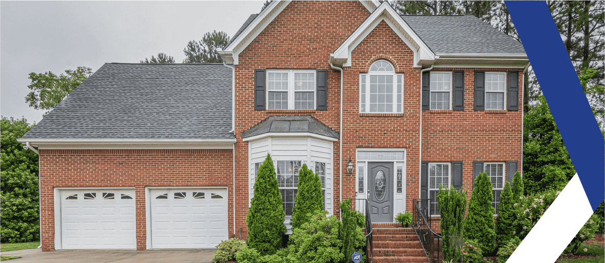 An image of the exterior of a brick home. Title Insurance Explained for First-Time Homebuyers
