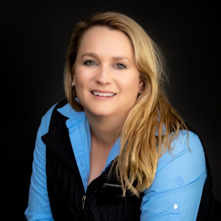 Marcie Buchholtz, real estate agent at Big Sky Properties of Montana, Inc, smiling in professional portrait, showcasing expertise in Montana property.