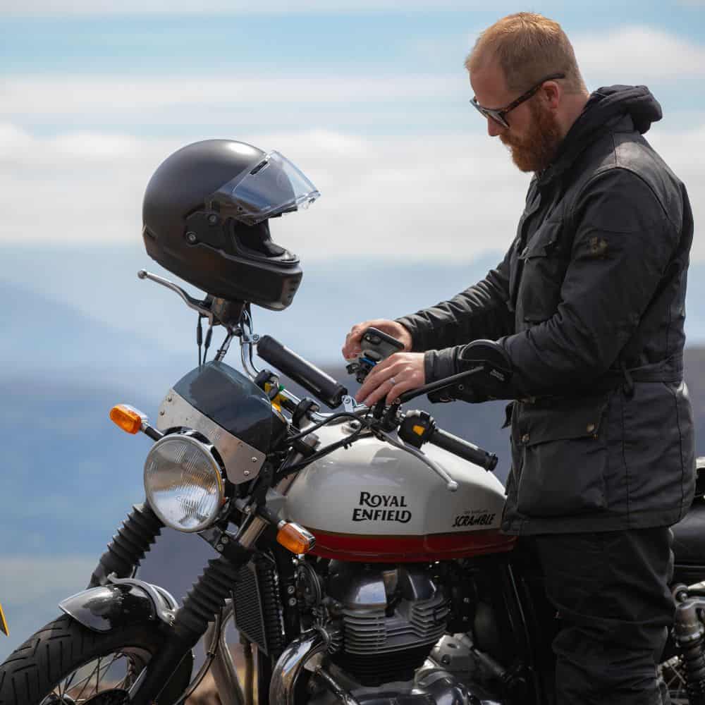 A motorcyclist on a Royal Enfield Interceptor 650, baker colour scheme.