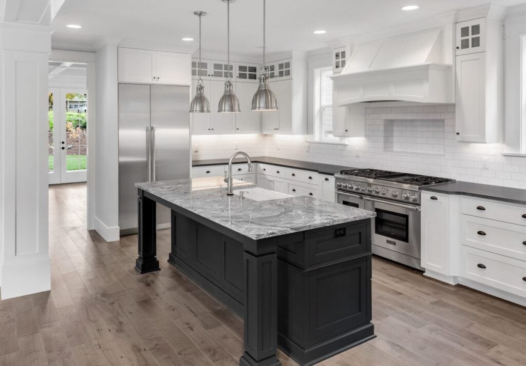 Modern renovated kitchen with island and stainless appliances