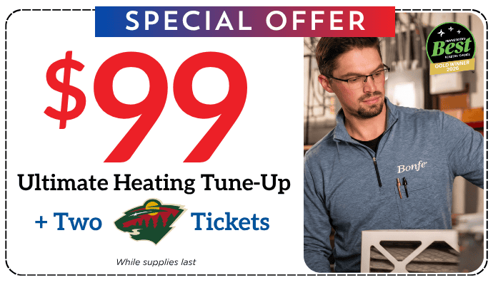 Bonfe’s ad highlights a $99 Ultimate Heating Tune-Up special, offers a chance to win two hockey tickets, and shares information about outdoor outlets. A Bonfe technician, wearing glasses and a blue shirt, carefully inspects a furnace filter as part of their quality service. The offer is available while supplies last.