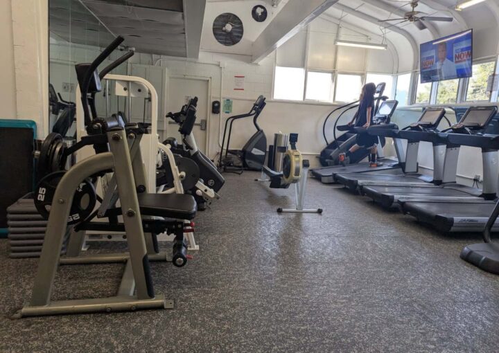 Weight room at Bay-O-Vista Swim & Tennis Club featuring modern cardio and strength equipment for members.