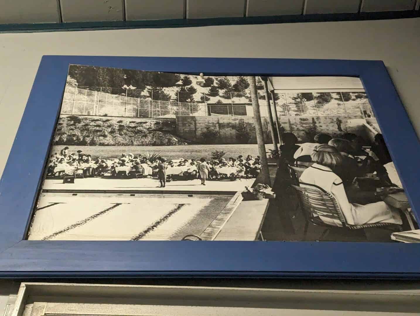 Vintage photograph of members and visitors enjoying the outdoor pool at Bay-O-Vista Swim & Tennis Club, showcasing a nostalgic scene of community aquatic recreation.