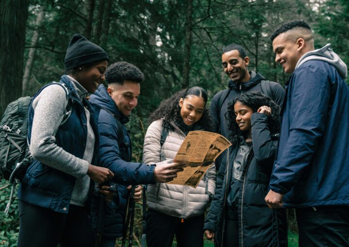 Family staying active together outdoors with creative fitness activities like hiking and obstacle courses.