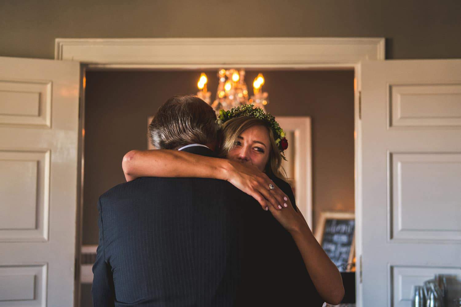 A bride hugging her father at a Littleton wedding.