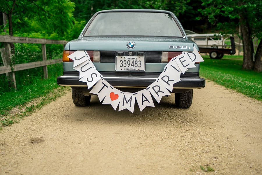 A car with a just married sign on the back.