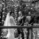 Keywords used: bride, groom
Bride and groom's love-filled backyard wedding captured in a black and white photo.