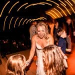A bride and her friends dancing on the emotional dance floor at a backyard wedding in La Crosse.
