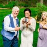 Courtney and James capturing love in their grassy backyard wedding.