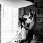 A Love-Filled bride getting her hair done in a cabin.