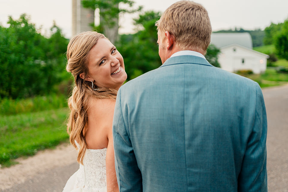 barn-at-copper-creek-bride-portrait-groom-reaction.jpg