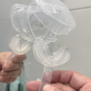 Clear orthodontic mouthguard for teeth protection and sports safety.