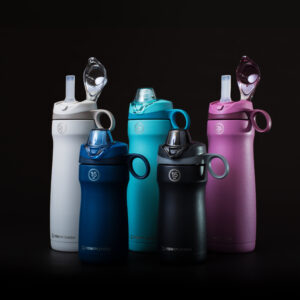 Portable inhalers for respiratory therapy in various colours against a black background.
