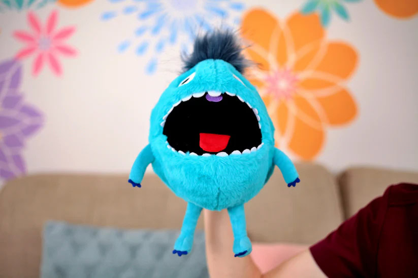 Bright blue plush monster toy with open mouth, ideal for stress relief and comfort.