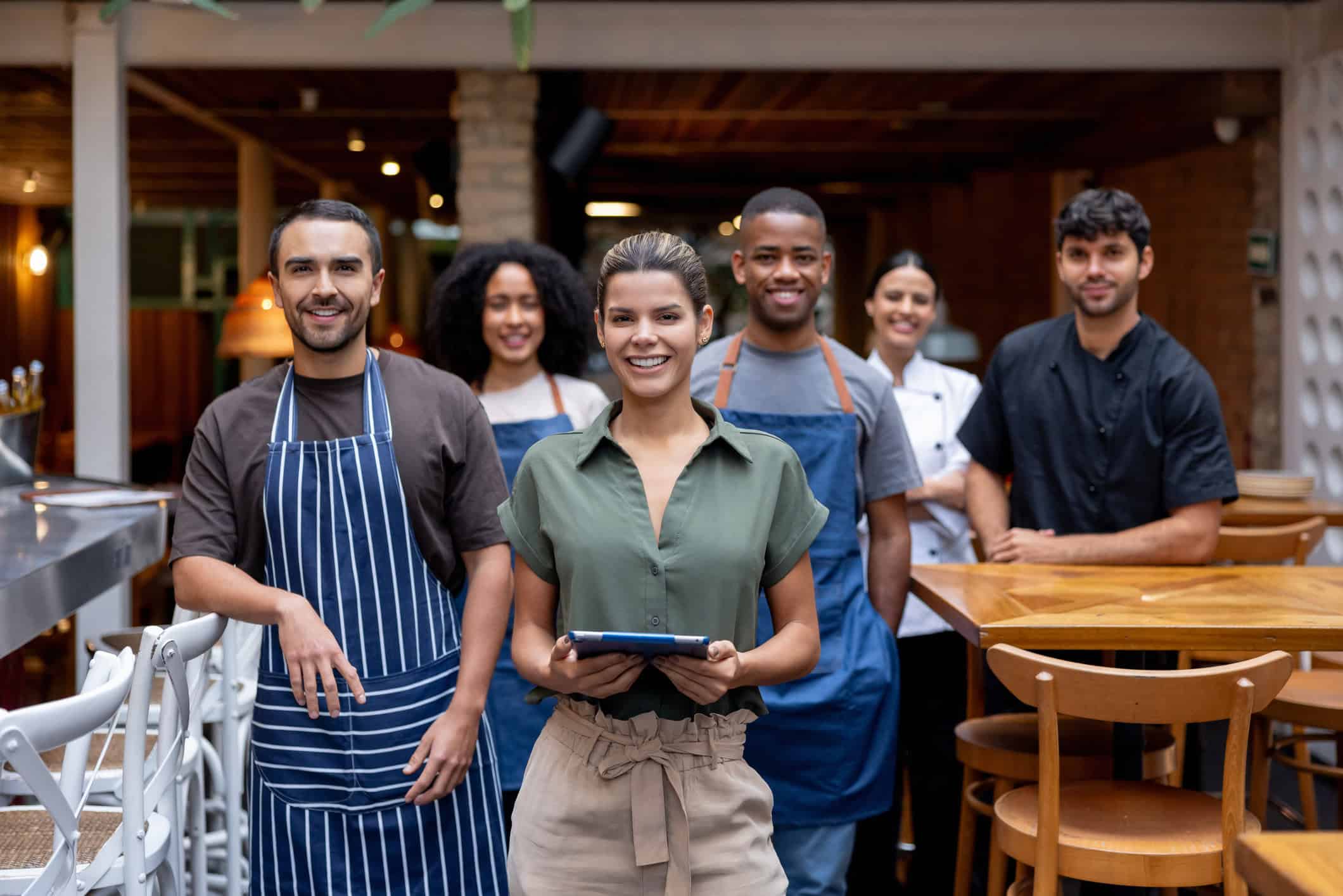 Friendly staff at a restaurant ready to serve customers.