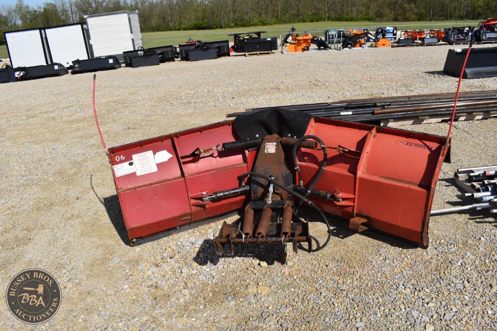 Snow plow attachment for tractor, ideal for winter snow removal, available at Bussey Bros Auctioneer.
