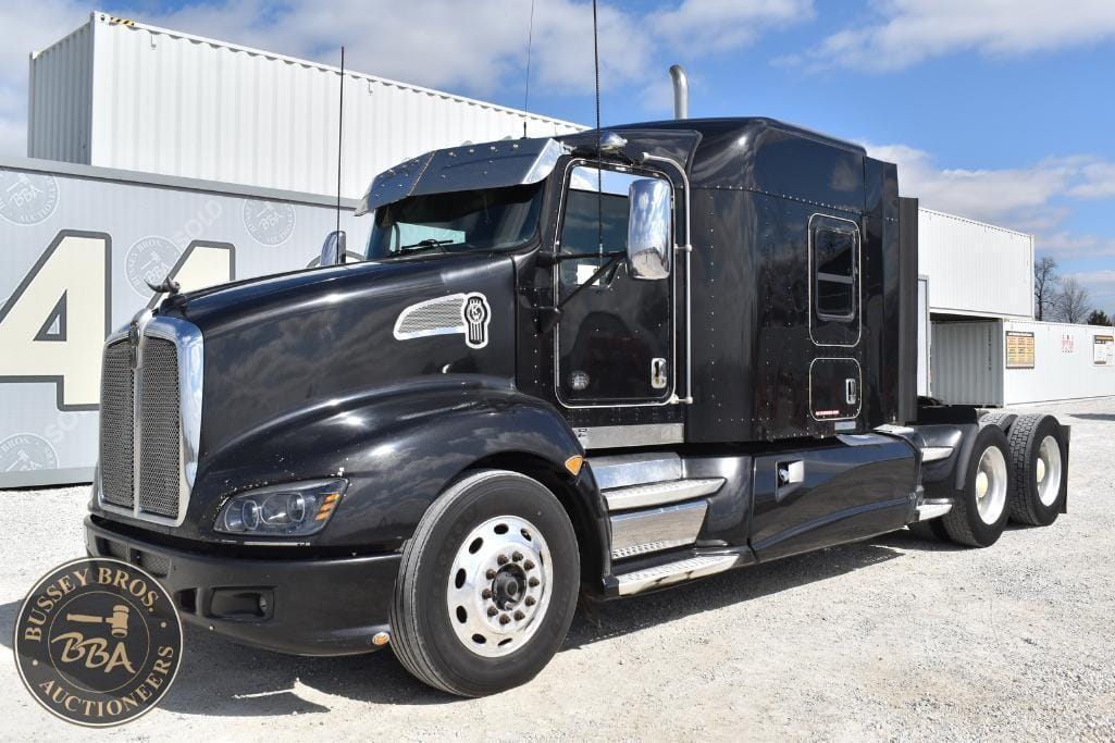 Black semi-truck tractor with sleek design and modern features. Ideal for freight transport and logi.