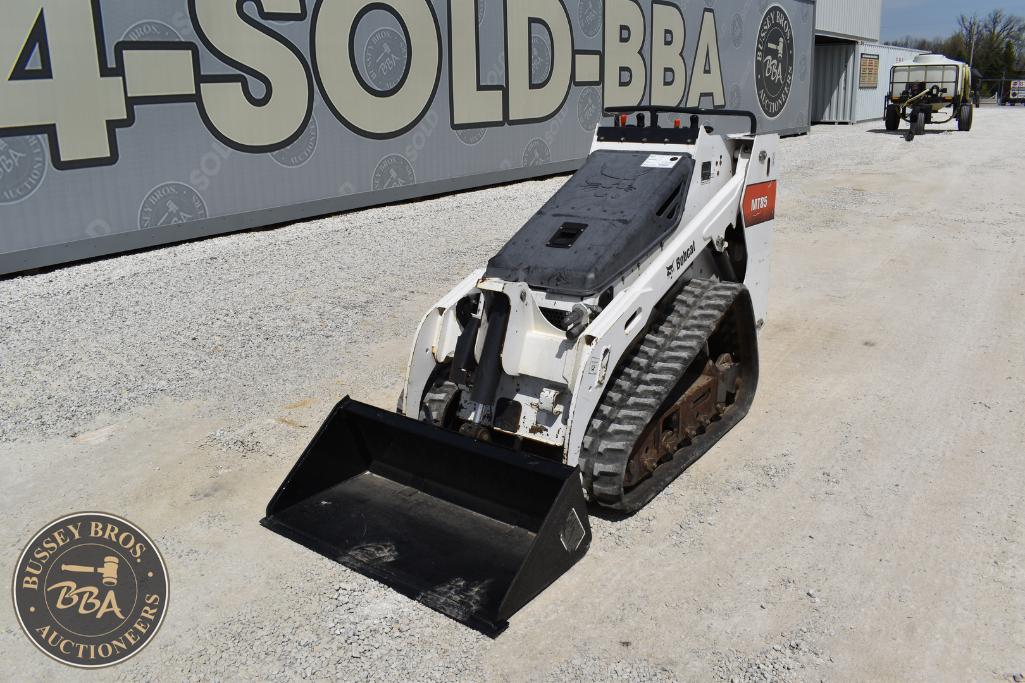 Excavator with tracked undercarriage at Bussey Bros Auction, ready for sale or construction use.