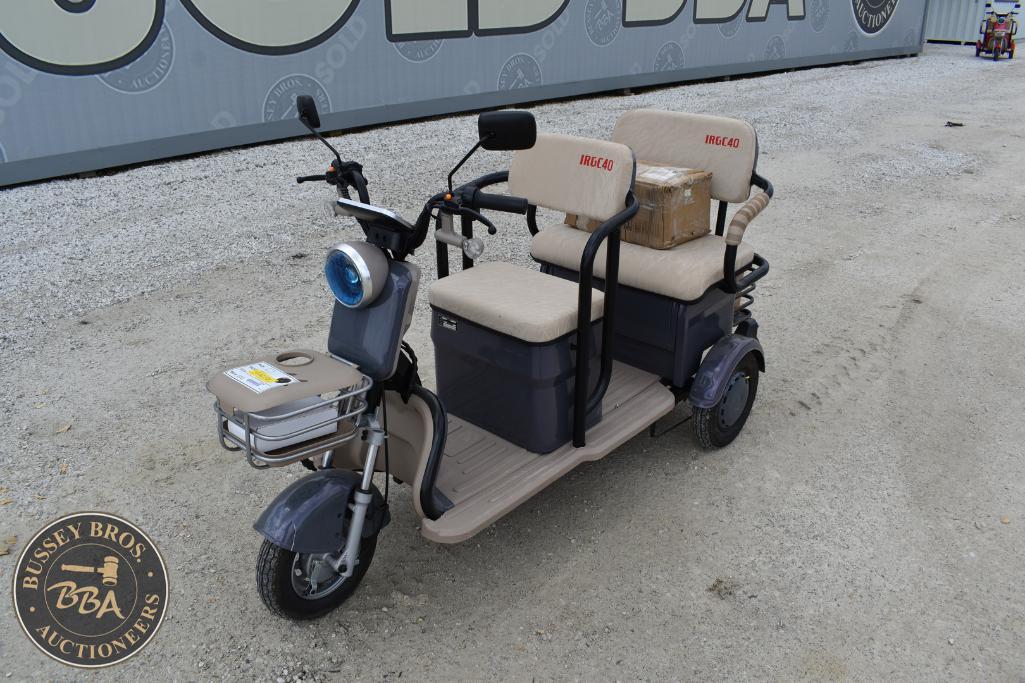 Electric mobility scooter with passenger seats and storage, suitable for assisted transport.