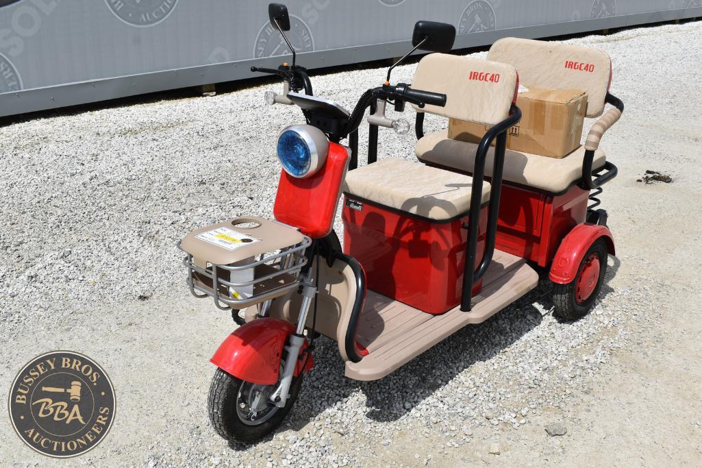 Electric mobility scooter with two seats for sale at Bussey Bros Auctioneers.