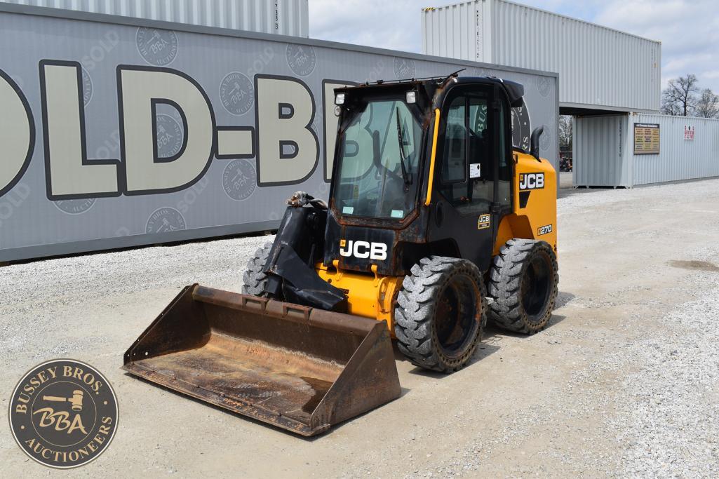 JCB compact loader parked outside Bussey Bros Auctioneers facility.