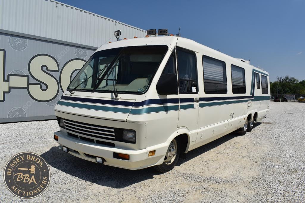 Classic white bus for sale at Bussey Bros Auctioneers, ideal for conversions or transport needs.