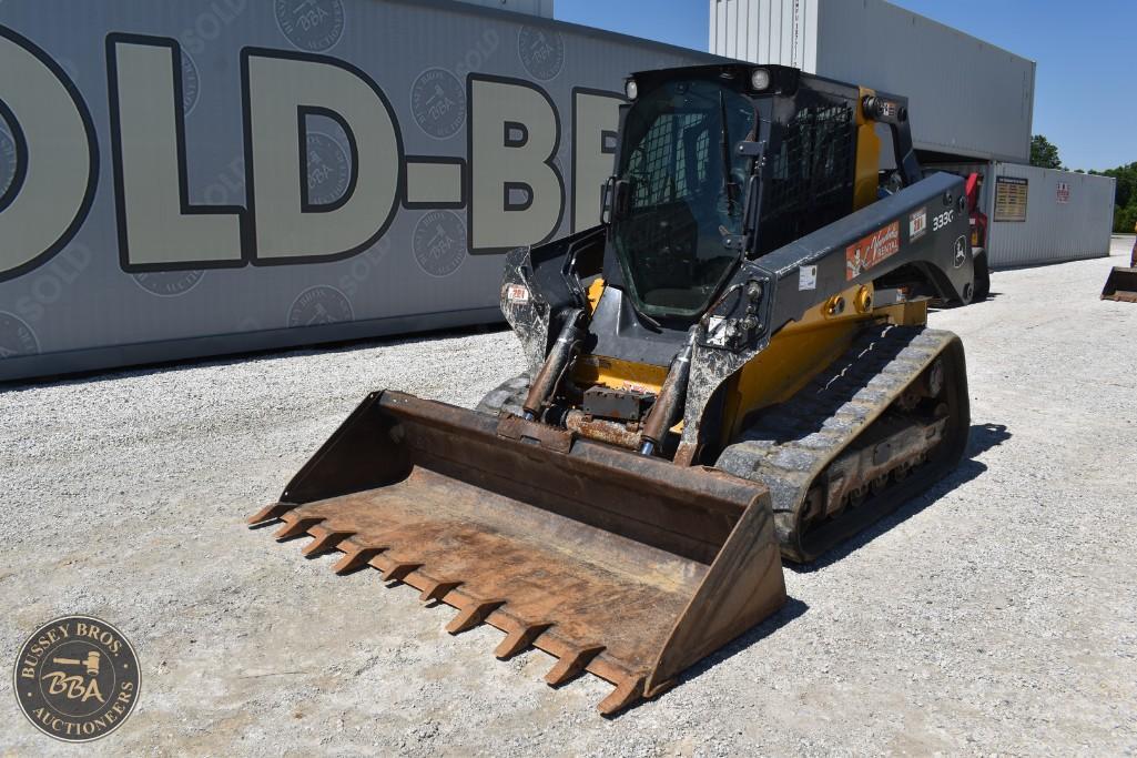 Excavator with a large bucket, ready for construction or demolition work, showcased at Bussey Bros A.