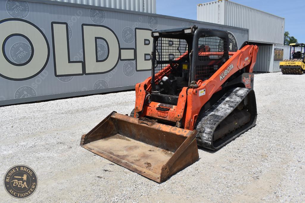 Mini skid steer loader with bucket attachment, ideal for construction, landscaping, and material han.