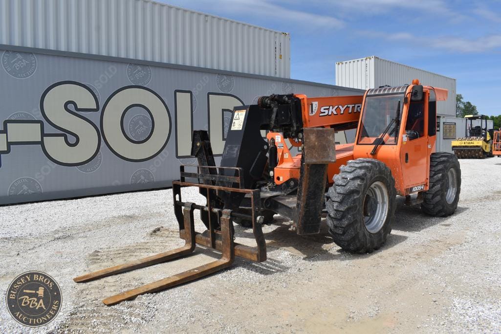 Forklift with Skytrak boom lift attachment at Bussey Bros Auctioneers, specializing in industrial ma.