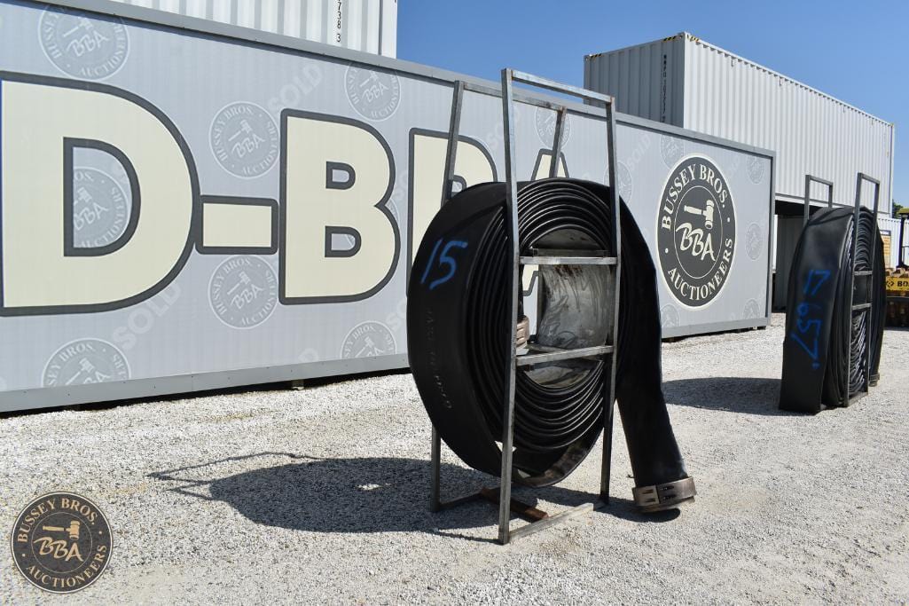 Heavy-duty D-brake hose reel at Bussey Bros Auctioneers yard for vehicle maintenance.