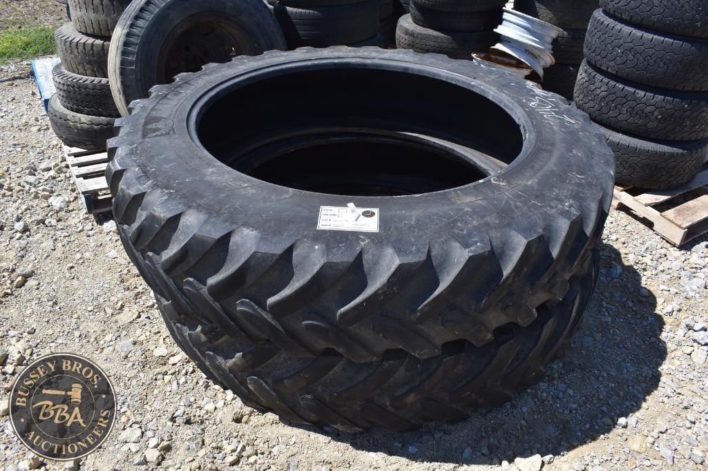 Large industrial tire for heavy machinery, suitable for construction or agricultural equipment.