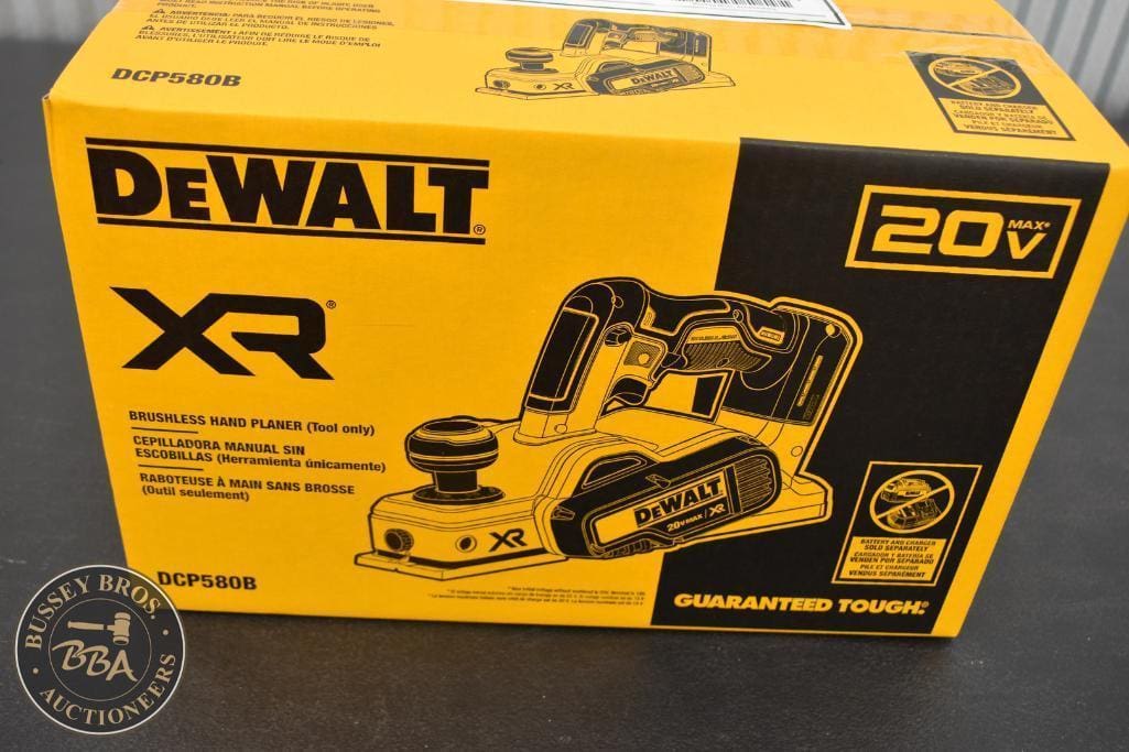 Impact driver in yellow and black packaging with DeWalt branding.