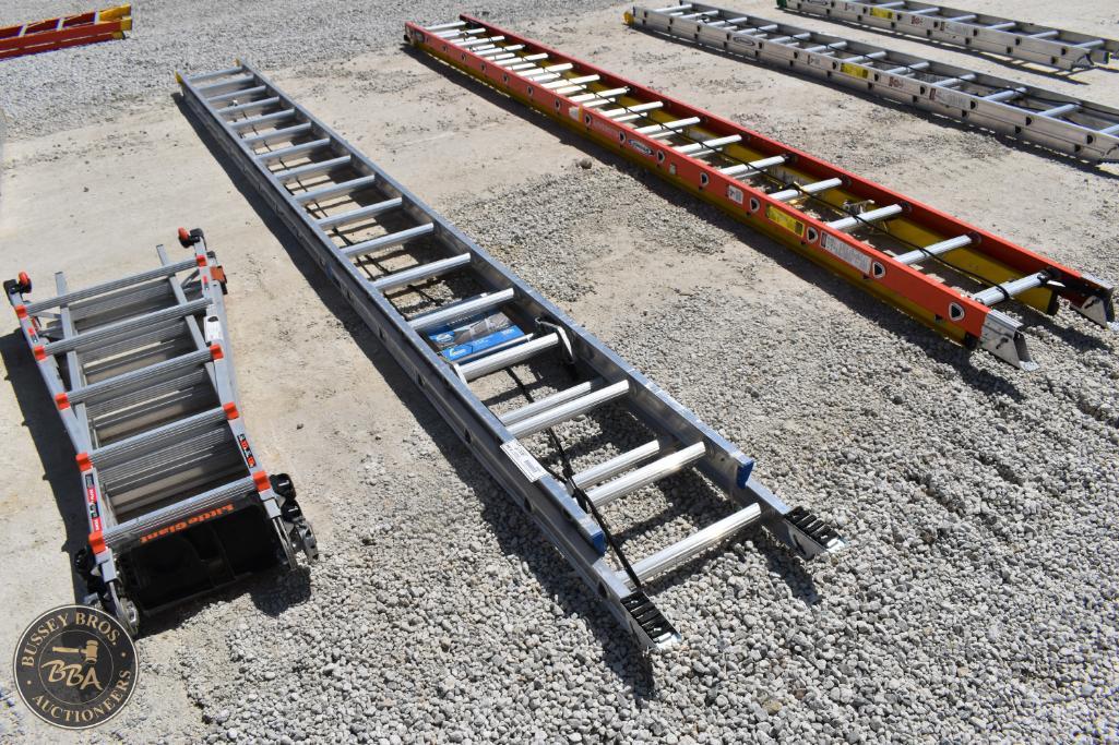 Ladders and scaffolding equipment displayed outdoors at Bussey Bros Auctioneers.