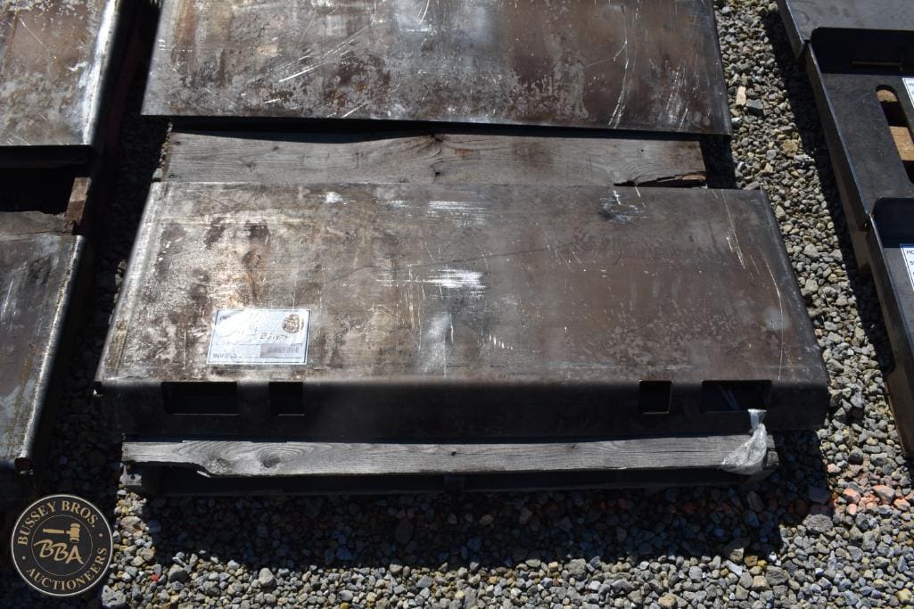 Heavy metal weight plates for sale at Bussey Bros Auctioneers.