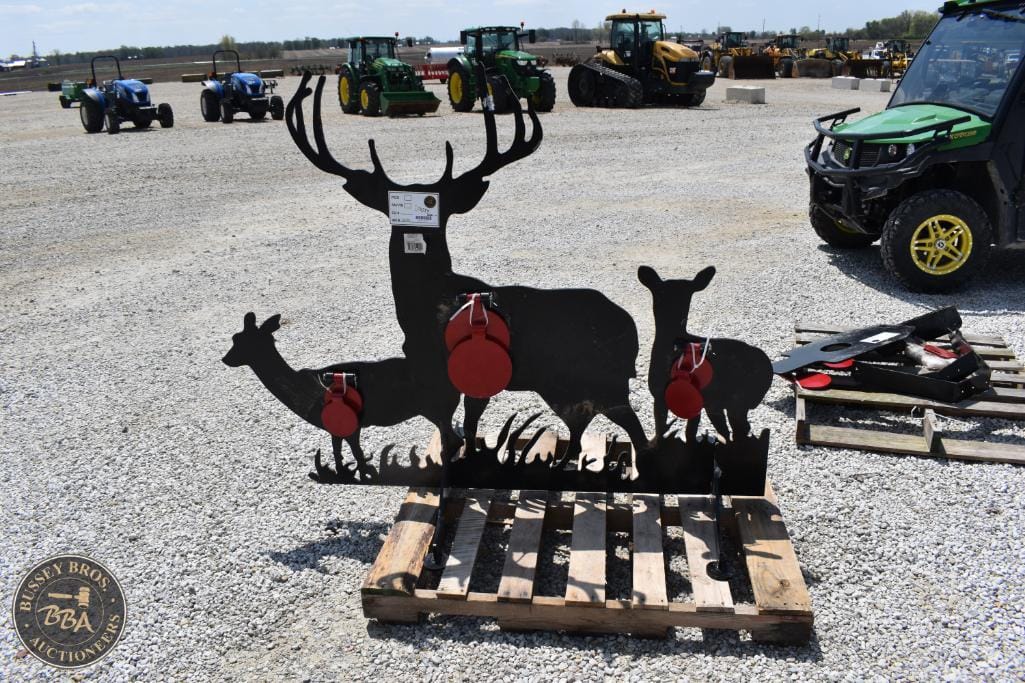 Deer sculpture with red accents, ideal for outdoor farm or rustic decor.