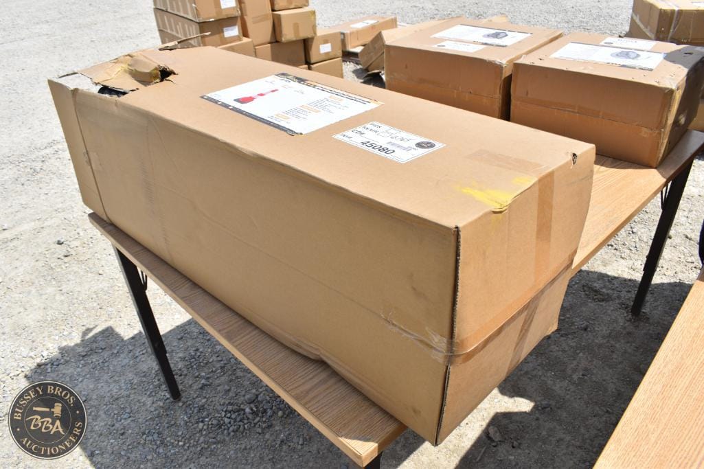 Boxes at Bussey Bros Auctioneers, showcasing packaging and shipping items for auction.