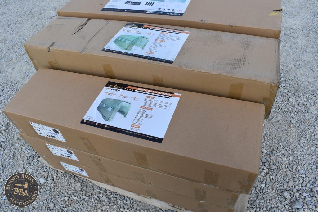 Stacked cardboard boxes with auction details for Bussey Bros Auctioneers.