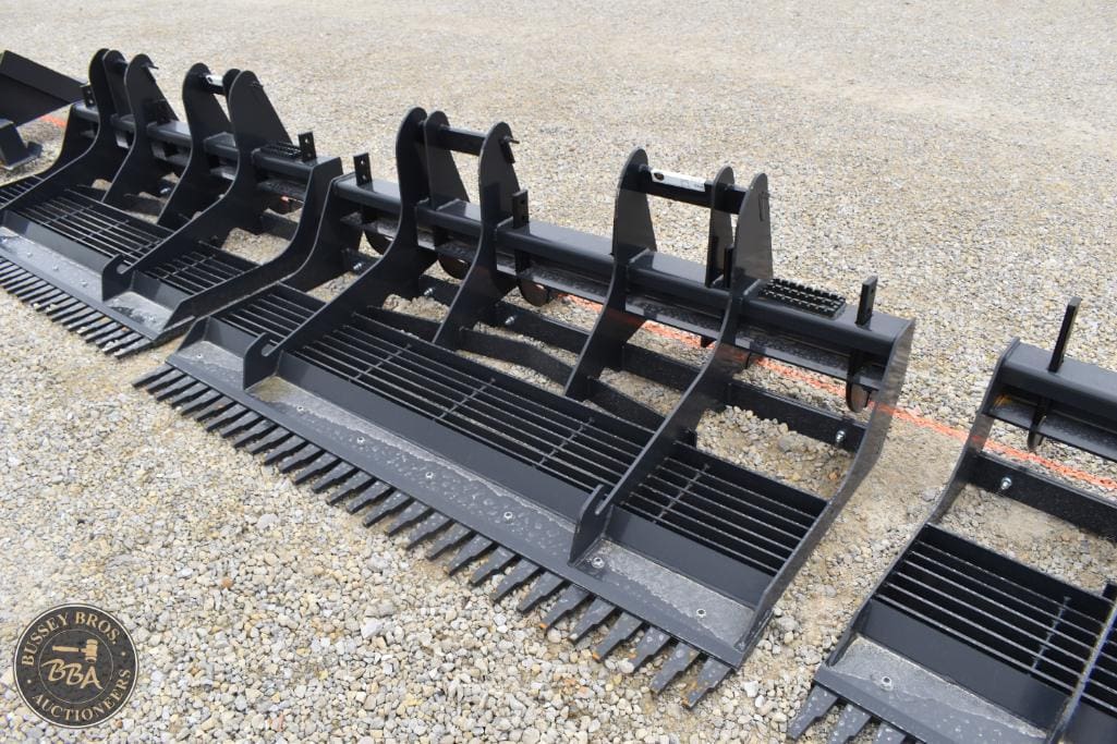 Heavy-duty black metal agricultural machinery for land clearing and farming.