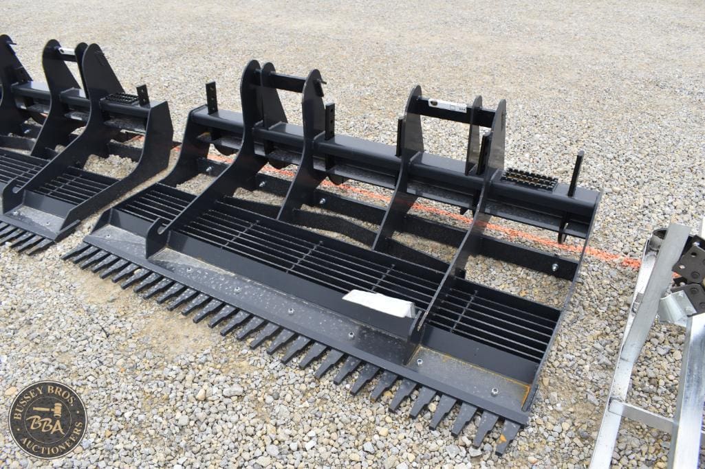 Agricultural equipment attachments for sale at Bussey Bros Auctioneers.