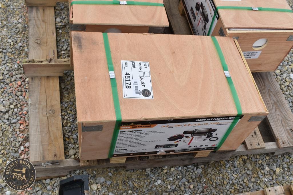 Wooden crate with green straps for auction at Bussey Bros Auctioneers.