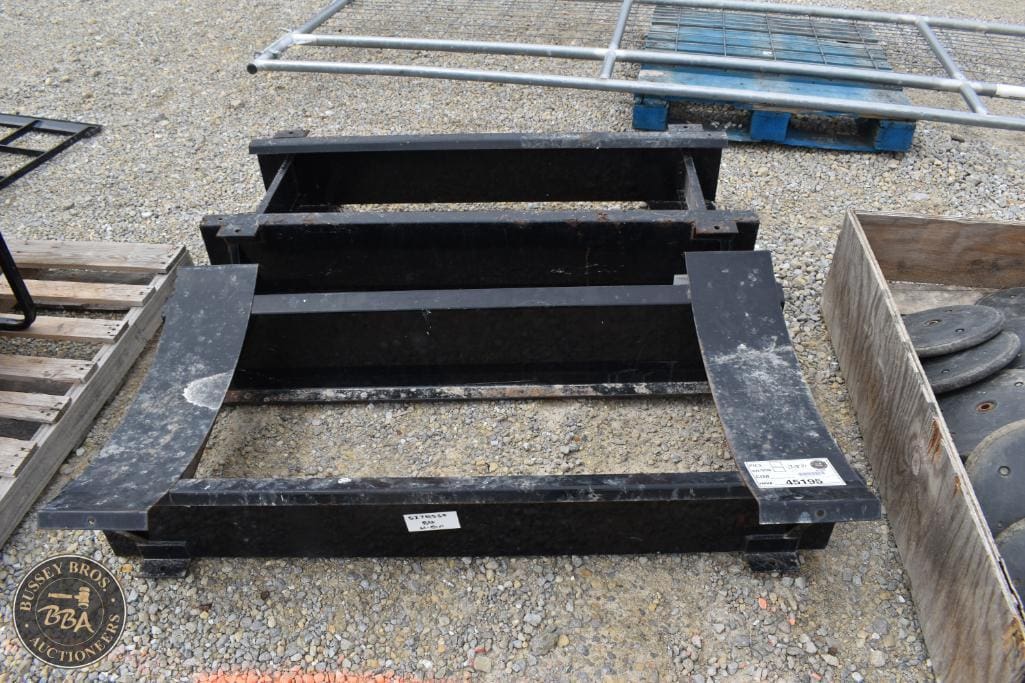 Heavy-duty black metal trailer frame for sale at Bussey Bros Auctioneers.