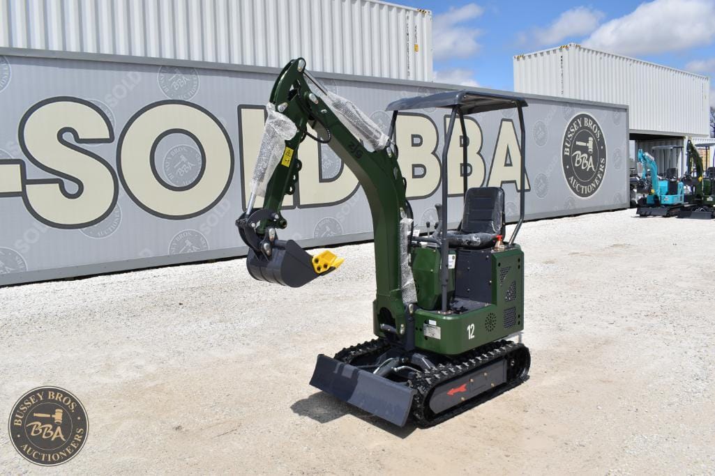 Mini excavator with tracked undercarriage, ideal for construction and landscaping projects.