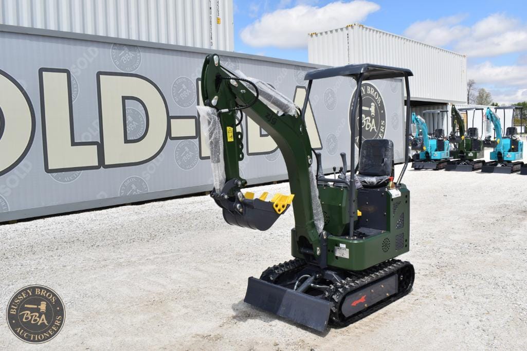 Mini excavator with tracked undercarriage and hydraulic arm, ideal for construction and landscaping.