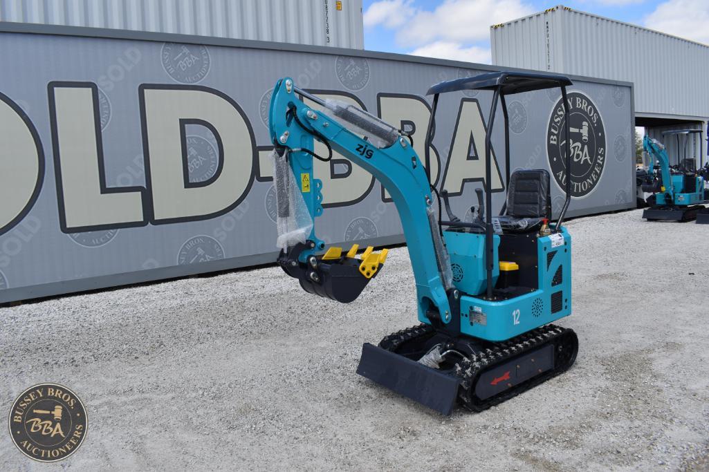Mini excavator with blue body and tracked wheels, ideal for construction and landscaping projects.